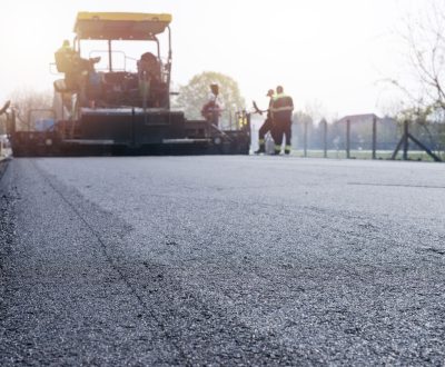 workers-placing-new-coating-asphalt-road (1) workers-placing-new-coating-asphalt-road (1)